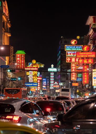 Night heavy traffic at Chinatown in Bangkok.  Vibrant and colourful signs