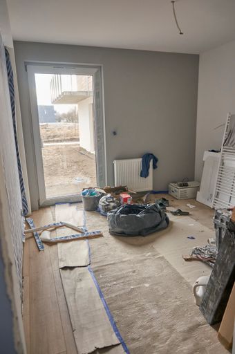 A vertical shot of a room under renovation in a apartment