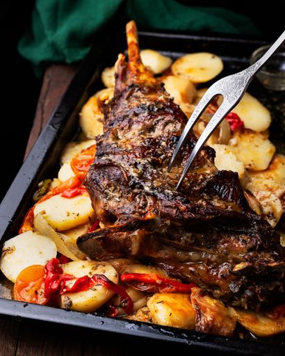 closeup photo of grilled fish on cooked potatoes