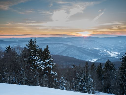 A horizontal shot of a snowscape taken on the top of Snowshoe Mountain at Snowshoe Ski Resort in West Virginia in February