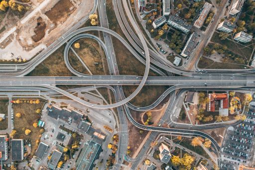 An aerial view of highway and overpass intersection