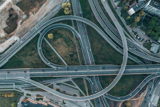An aerial view of highway and overpass intersection