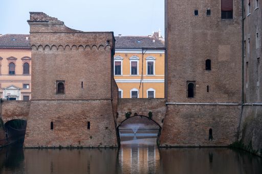 The beautiful buildings and arch-shaped bridges over the river captured in Ravenna, Italy