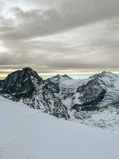 A vertical shot of snow-covered mountains during winter in Passo Tonale, Italy