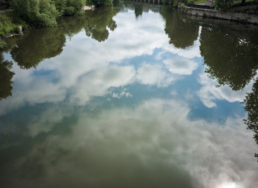 The beautiful cloudscape reflecting on water of River Severn passing through Shrewsbury, Shropshire