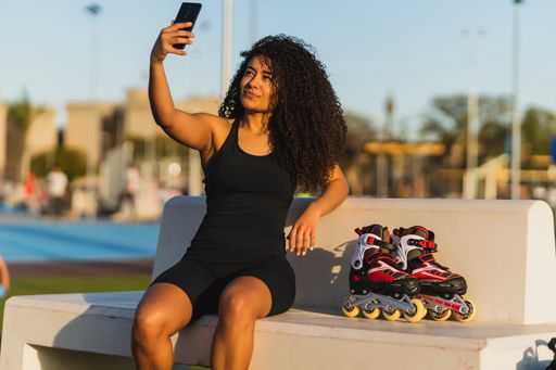 A closeup shot of a beautiful girl taking a selfie with her phone