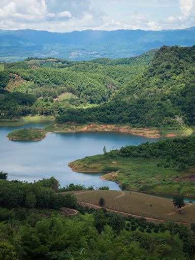 A vertical shot of a mountainous landscape in Chiang Rai, Thailand