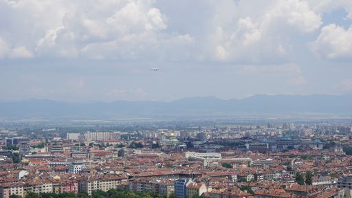 An aerial beautiful shot of a cityscape under a cloudy sky at daytime