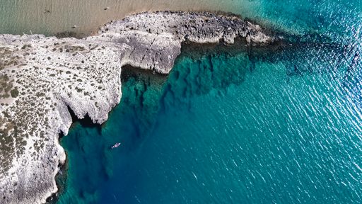 A beautiful high angle view of rocky cliffs on the water on the Beach of Architiello of San Felice, Italy