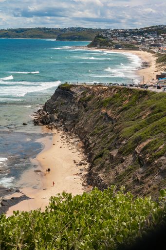 A vertical shot of the Newcastle beach from the top.