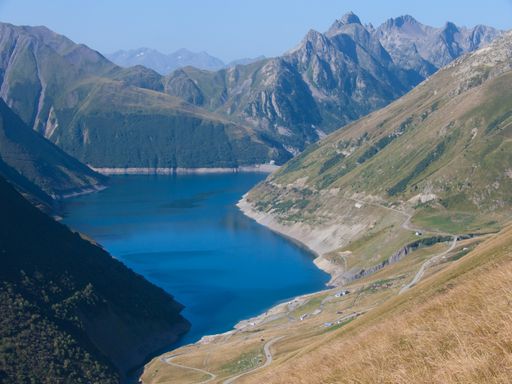 An aerial view of a river and mountains in Barrage de Grand Maison, Haute Savoie, France