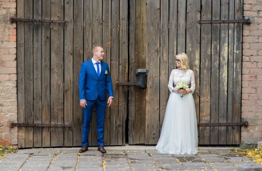 A beautiful shot of a newlywed couple posing for a photo