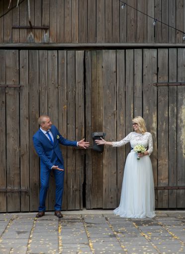 A beautiful shot of a newlywed couple posing for a photo