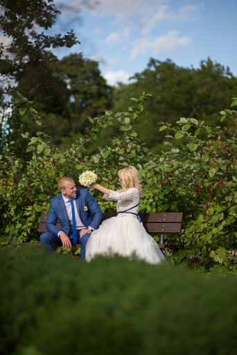A beautiful shot of a newlywed couple posing for a photo