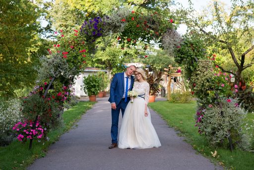 A beautiful shot of a newlywed couple posing for a photo