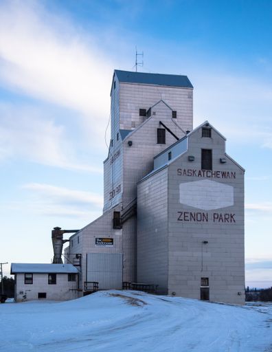 A vertical shot of Zenon Park grain elevator on a snowy winter day, Wadena, SK, Canada