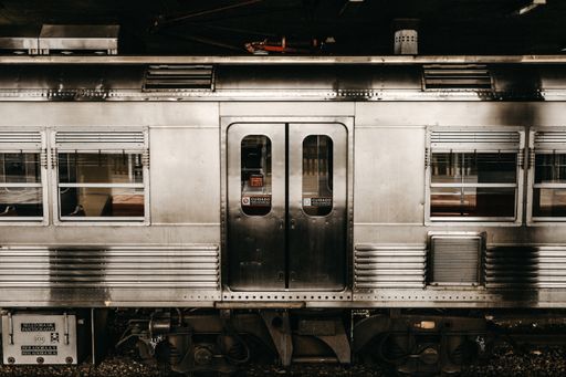 A horizontal shot of grey metallic train doors
