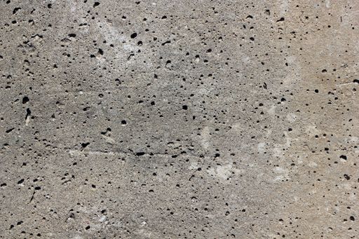 A closeup of a grey wall under the sunlight - perfect for textures and backgrounds