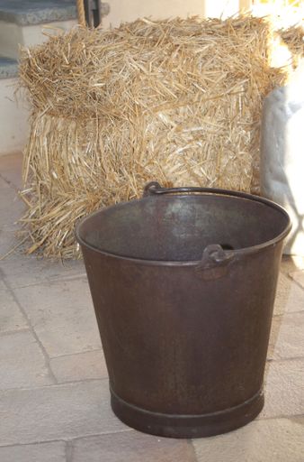 A closeup shot of a rusty bucket