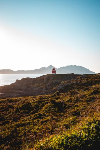 A vertical shot  of the Faro de Punta Robaleira Lighthouse, located on the coast of Galicia in Spain