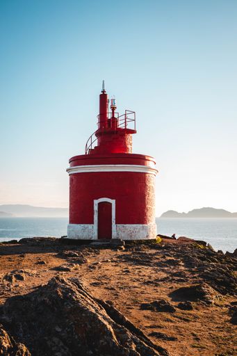 A vertical shot  of the Faro de Punta Robaleira Lighthouse, located on the coast of Galicia in Spain