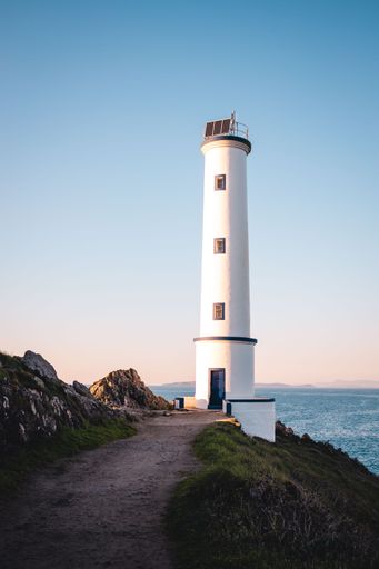 A Vertical view of the Cabo Home Lighthouse, which is located on the coast of Galicia in Spain