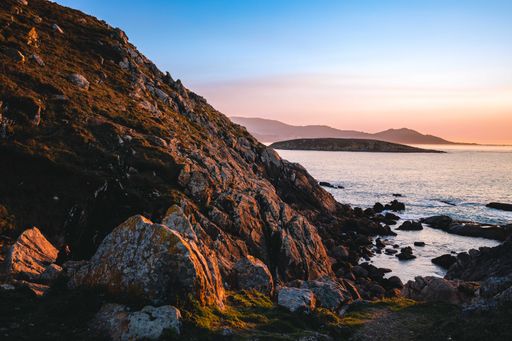 A beautiful view over the rocks to the sea during sunset