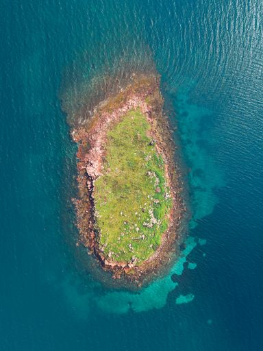 An aerial view of a small island of the Aegean sea