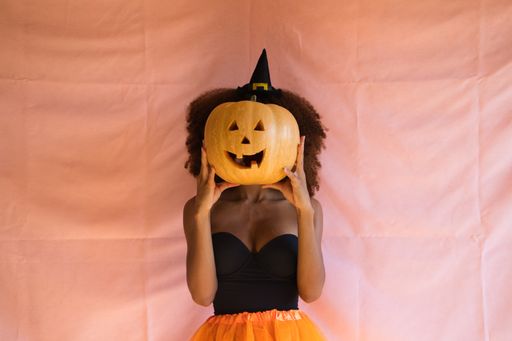 The young african american woman in witch costume for halloween party.