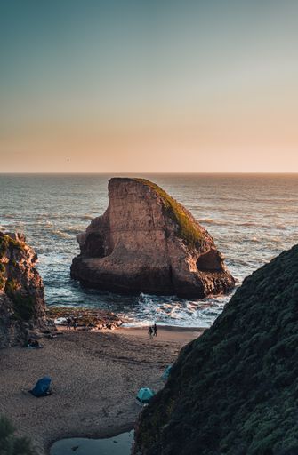 A vertical shot of the Shark Fin Cove near the Pacific Highway.