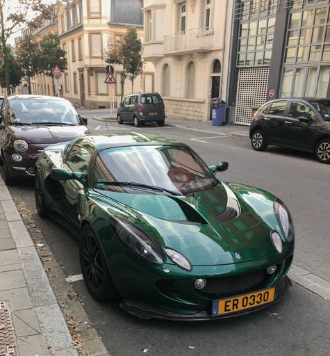 Green Lotus Elise with hardtop, parked in the street in Luxembourg citw