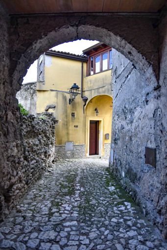 A narrow street among the old houses of a medieval town in the province of Caserta, in the Campania region.