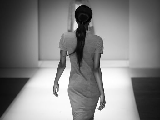 Model walking a catwalk during a fashion show