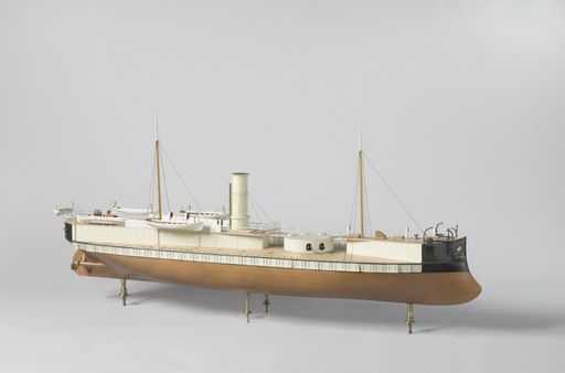 A closeup shot of a small vintage figurine of a ship isolated on a white background