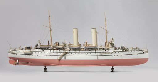 A closeup shot of a vintage figurine of a ship isolated on a white background