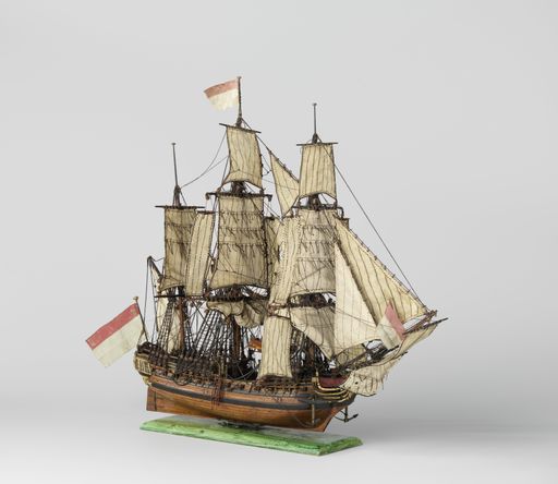 A closeup shot of a small vintage figurine of a ship isolated on a white background