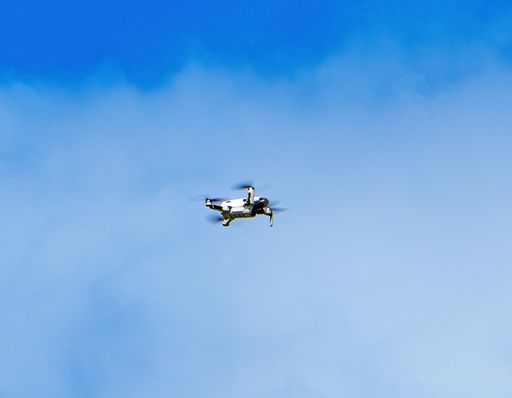 drone flying against blue cloudy sky on a beautiful day in Costa Rica