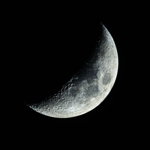 a view of the moon through a telescope on a clear night