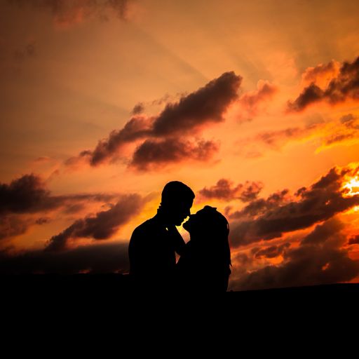 A silhouette of an affectionate couple against sunset or sunrise sky
