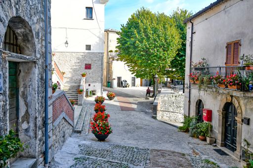 A narrow street among the old stone houses of Castro dei Volsci, a medieval town in the Lazio region.