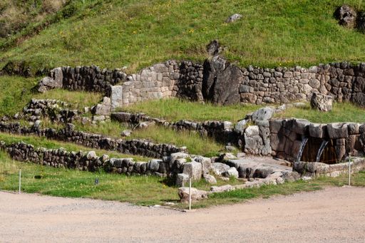 A beautiful view of the Tambomachay, Inca archaeological site with fountains and stone walls in Peru
