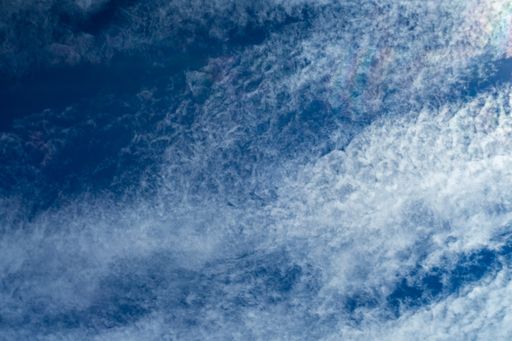 A low angle shot of a blue cloudy sky at daytime - perfect for wallpapers and backgrounds