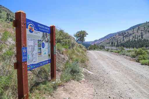A sign marks the Tahoe-Pyramid trail, a popular recreation trial for hikers and cyclists, along the Truckee River and Interstate 80 in Nevada.