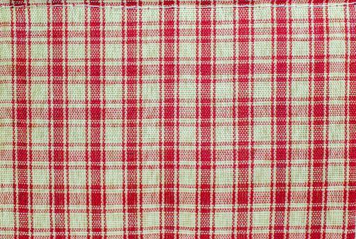 A piece of checkered fabric with red and white lines - perfect for background