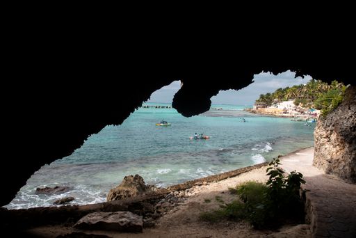 Some people kayaking at Cancun beach on a sunny day