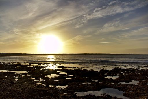 A mesmerizing view of the golden sunset over the sea