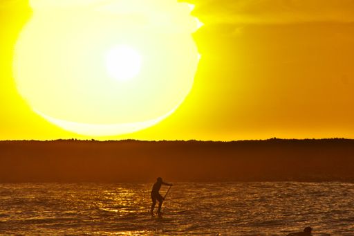 A mesmerizing view of the golden sunset over the sea