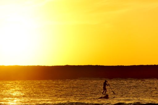 A mesmerizing view of the golden sunset over the sea