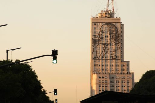Building of the Ministry of Social Development, in dawn sunrise, with large steel image of Eva Peron (Evita) giving a passionate speech.