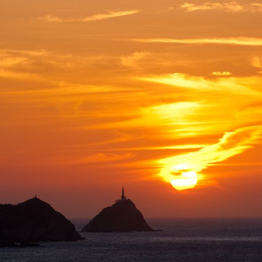 A breathtaking sunset scenery with the golden sky over Taganga, Colombia